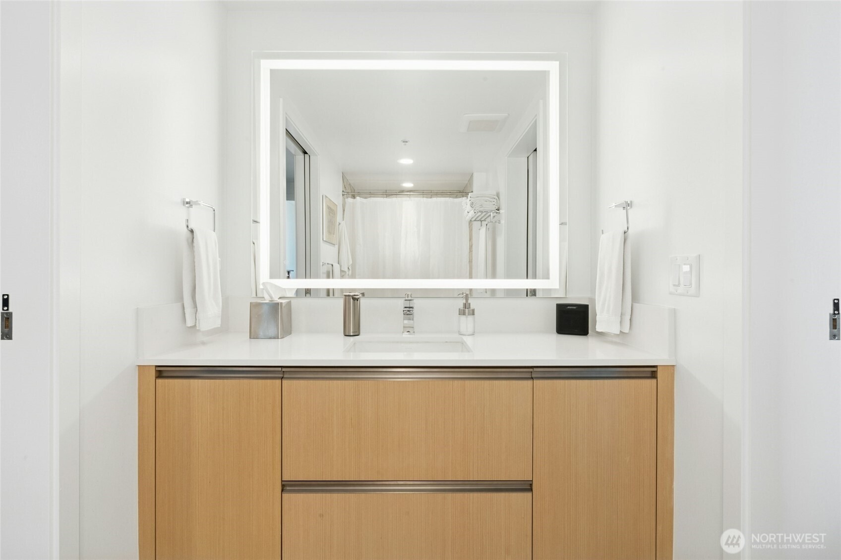 1808 Minor Avenue, Unit 3213 Seattle, WA 98101 - Photo 14 of 40 a bathroom with a sink and a mirror