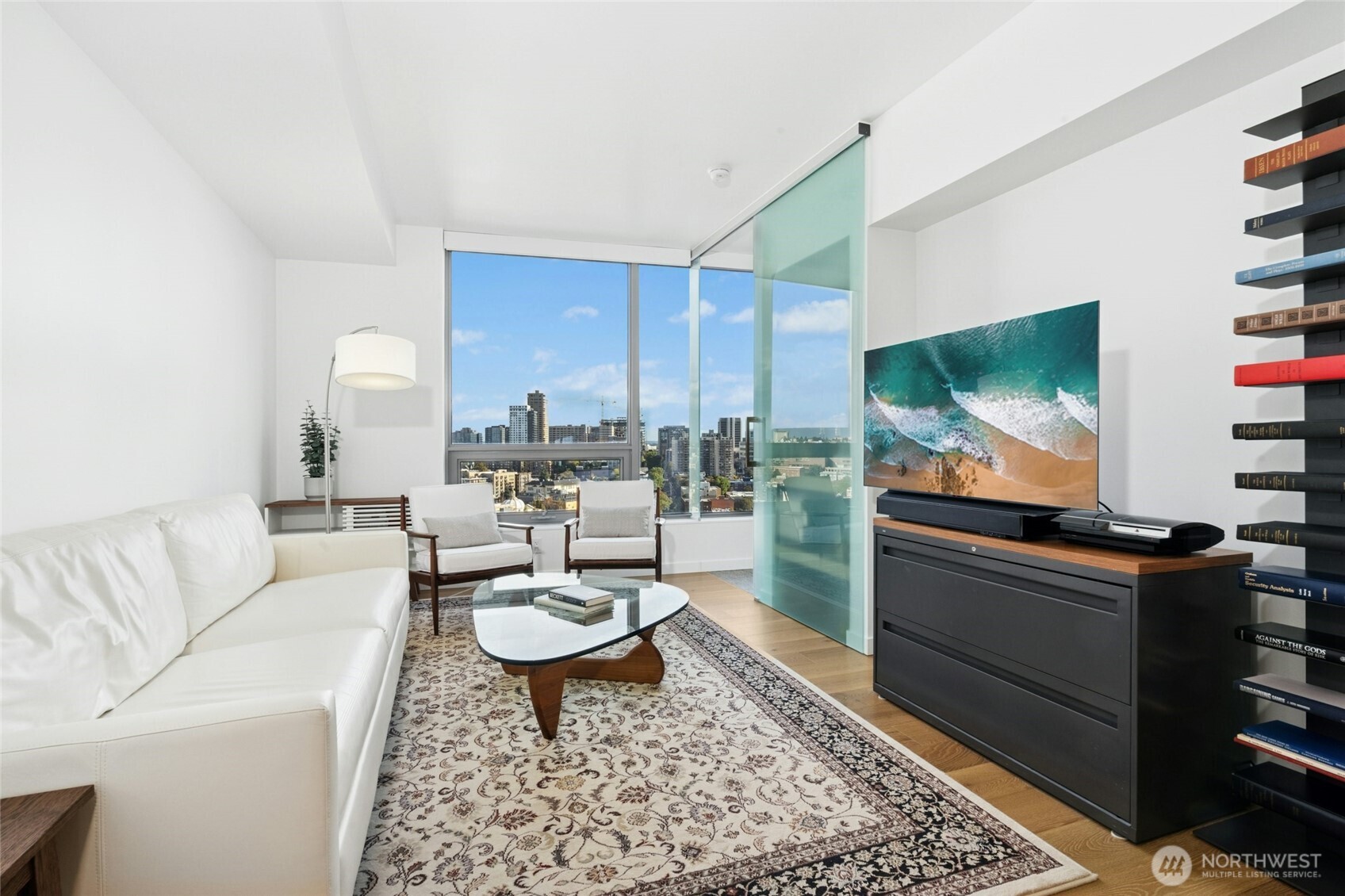 1808 Minor Avenue, Unit 3213 Seattle, WA 98101 - Photo 3 of 40 a living room with furniture and a flat screen tv