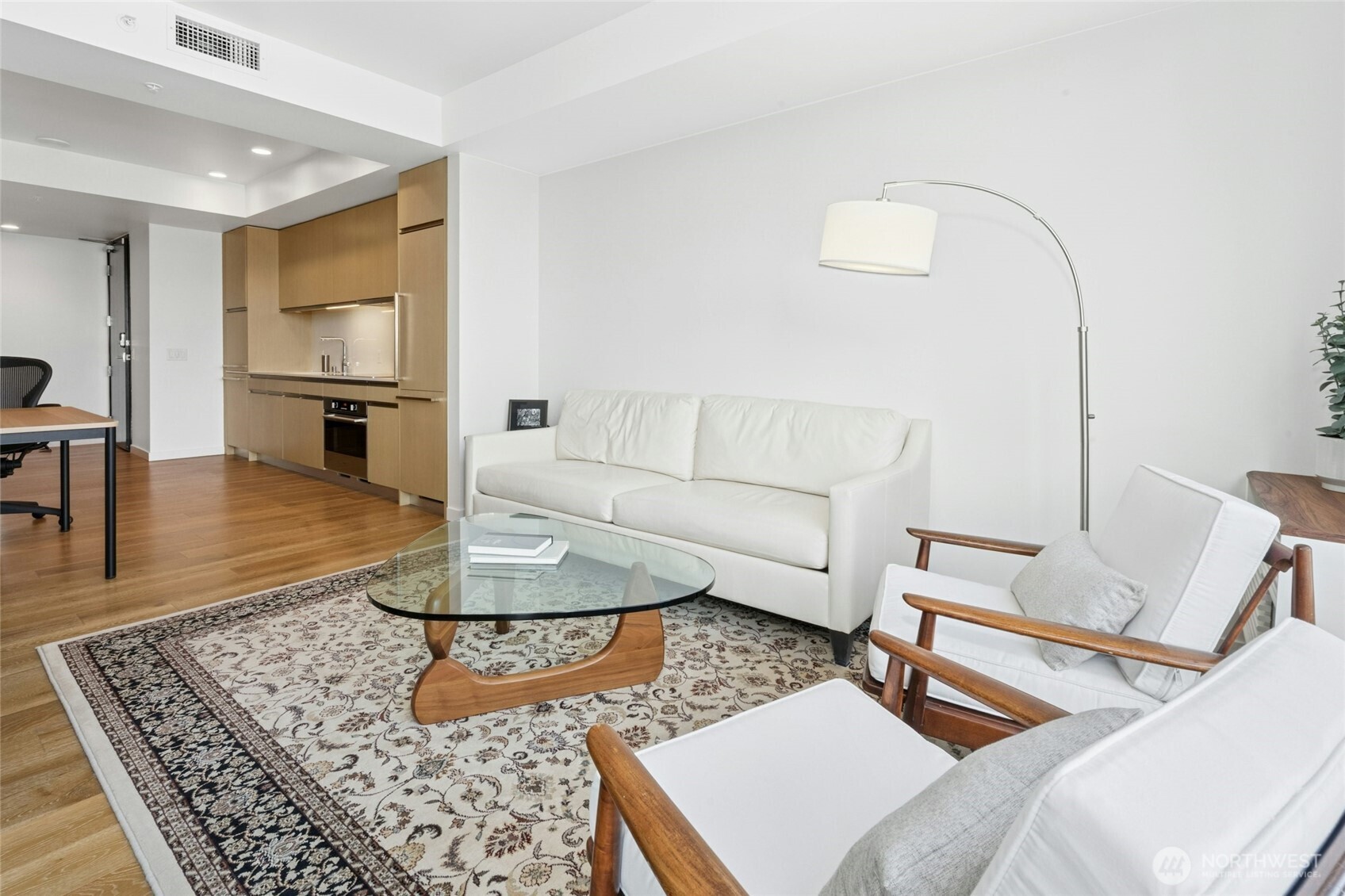1808 Minor Avenue, Unit 3213 Seattle, WA 98101 - Photo 7 of 40 a living room with furniture and wooden floor