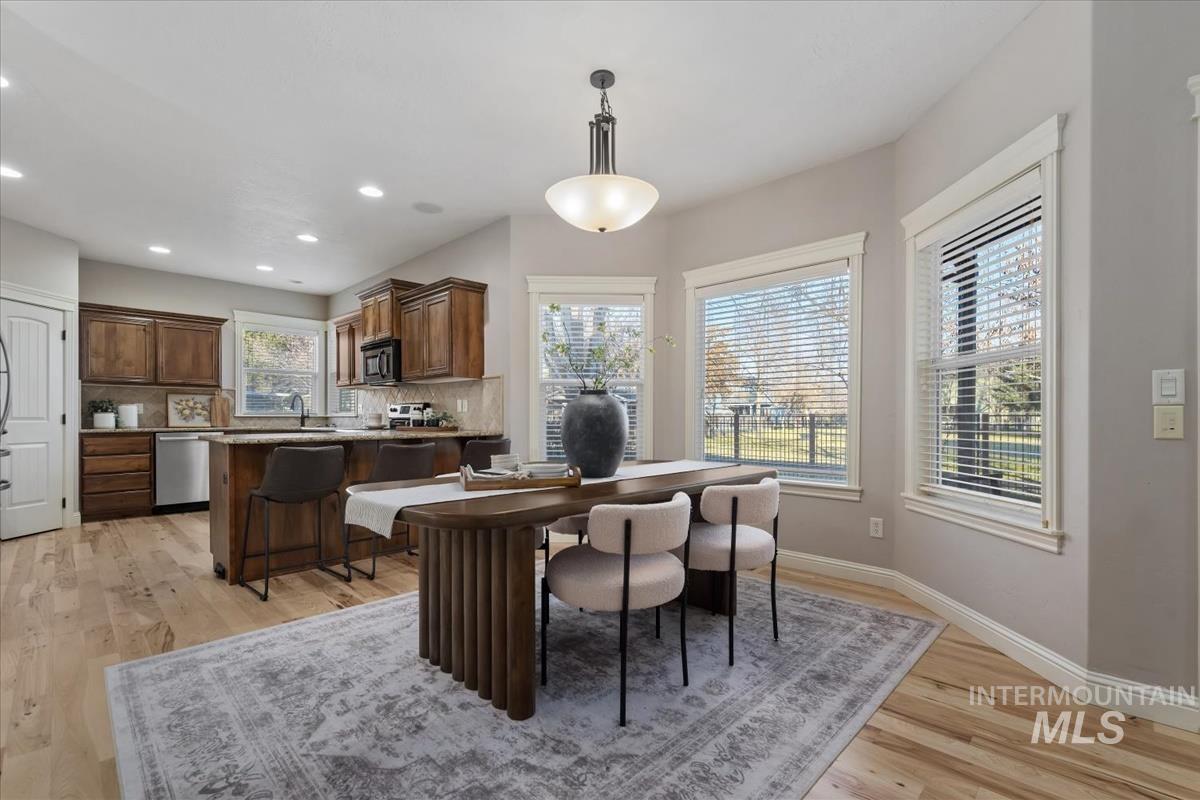 1082 East Azan Street Meridian, ID 83646 - Photo 12 of 47 Dining space featuring light wood finished floors and recessed lighting