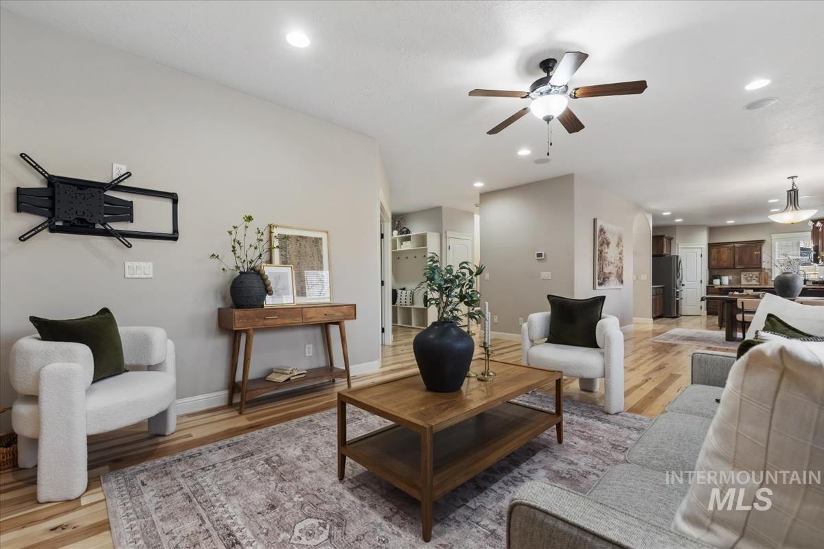 1082 East Azan Street Meridian, ID 83646 - Photo 14 of 47 Living area with recessed lighting, light wood-style flooring, and ceiling fan