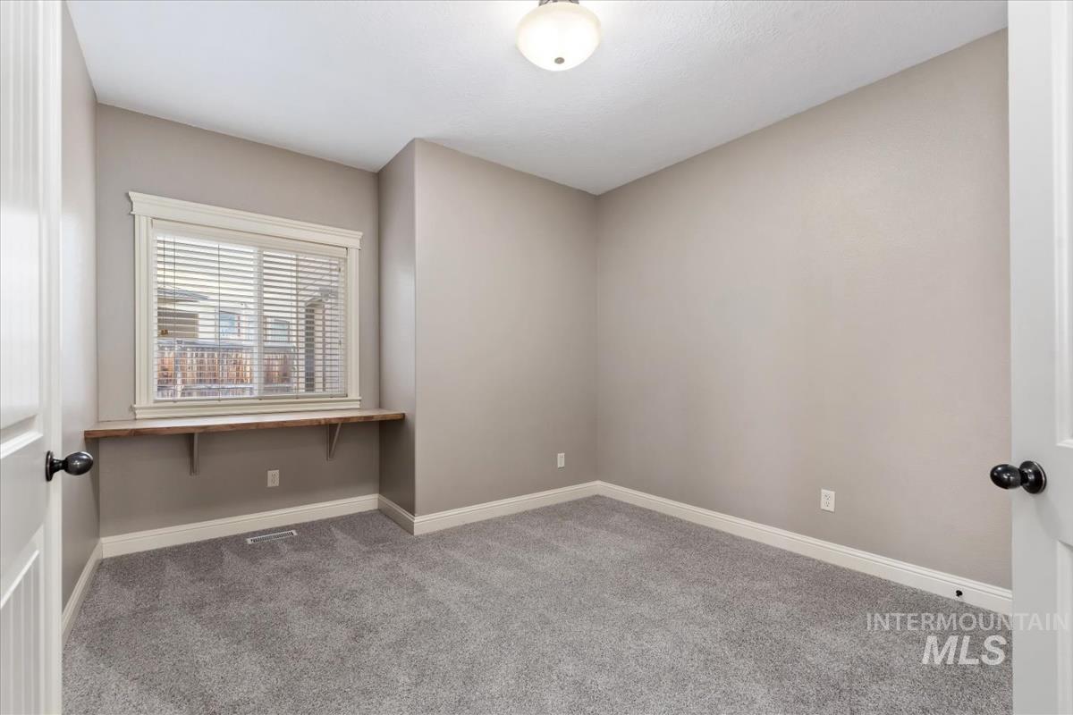 1082 East Azan Street Meridian, ID 83646 - Photo 17 of 47 Carpeted empty room featuring baseboards