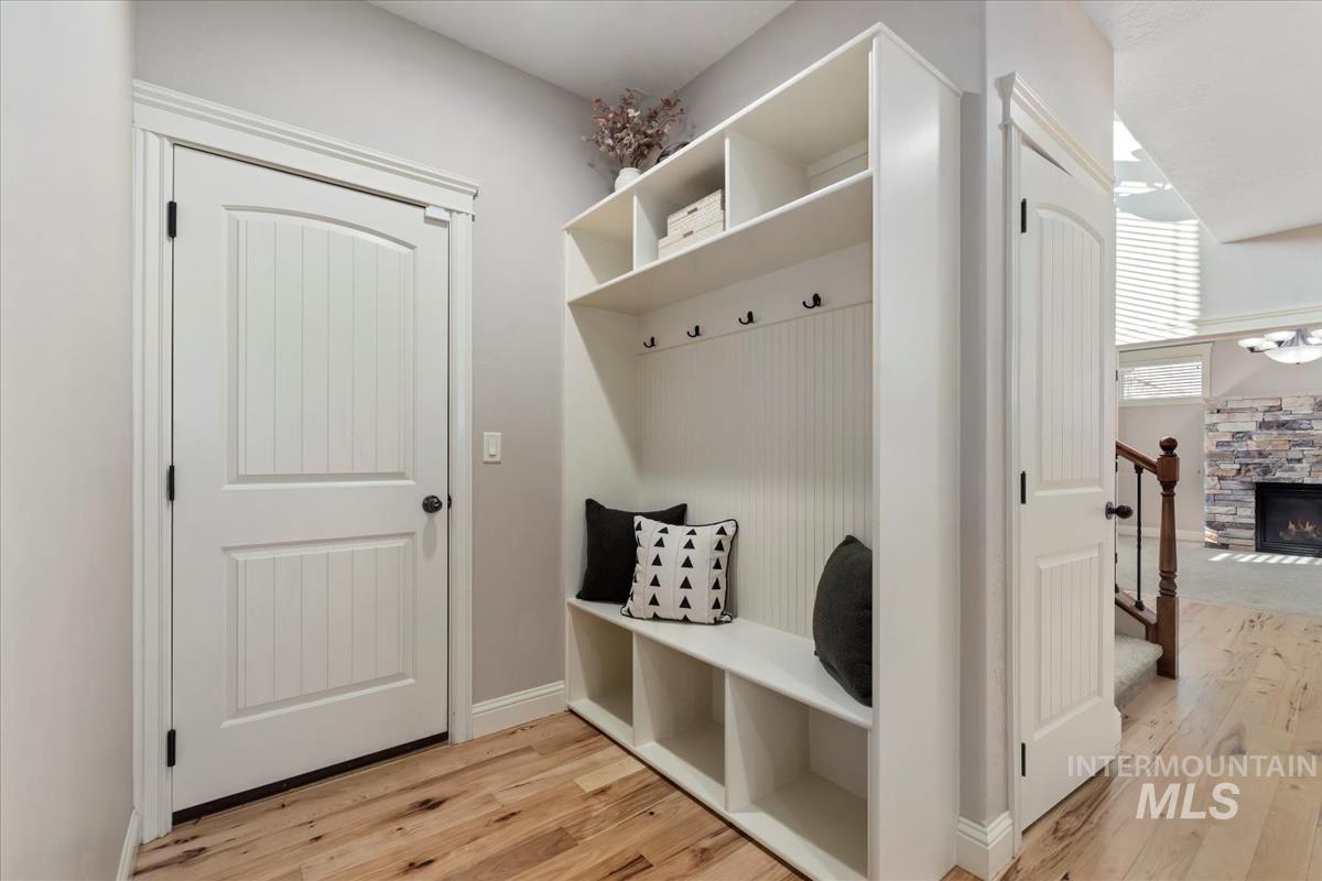 1082 East Azan Street Meridian, ID 83646 - Photo 20 of 47 Mudroom featuring light wood-style flooring and a fireplace