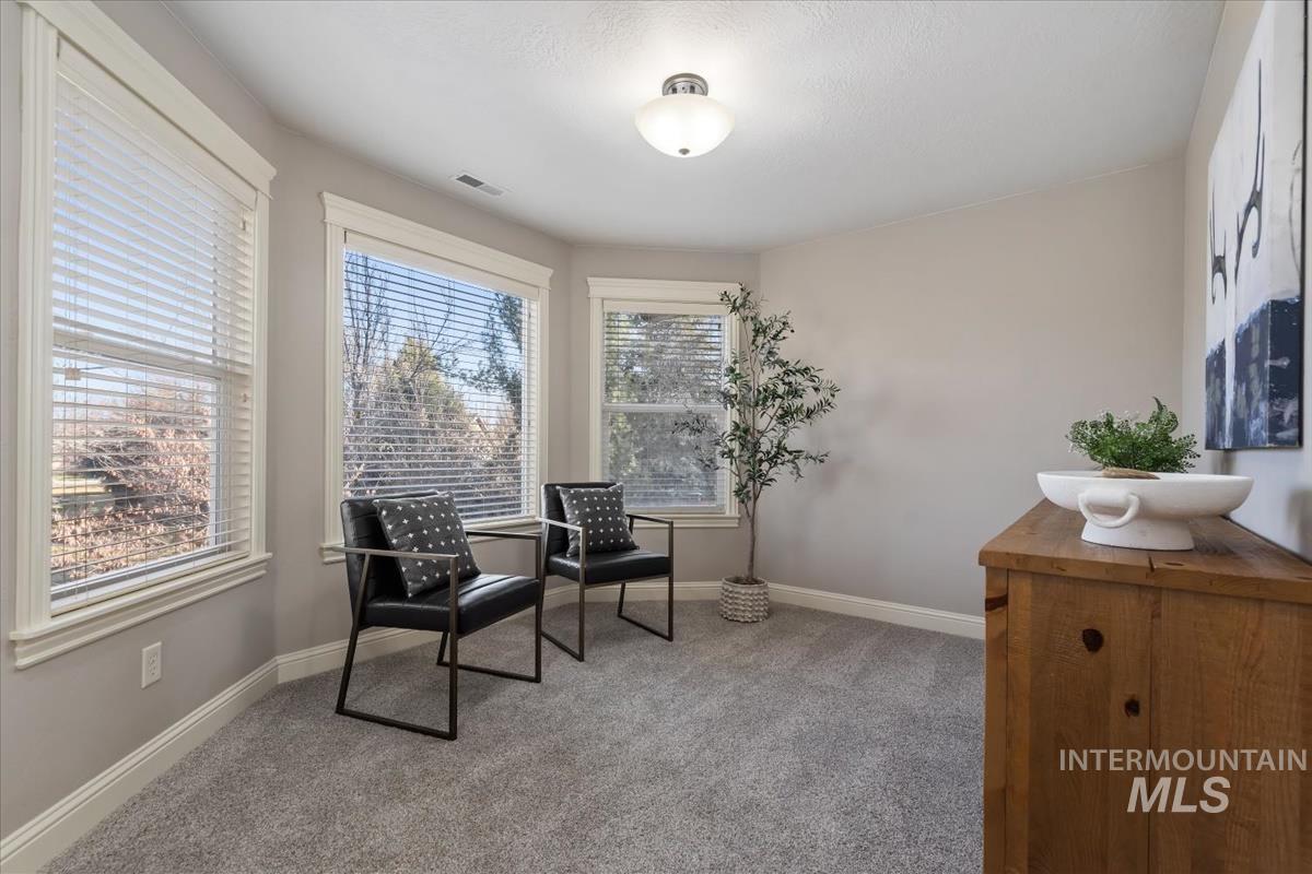 1082 East Azan Street Meridian, ID 83646 - Photo 25 of 47 Sitting room featuring light colored carpet and baseboards
