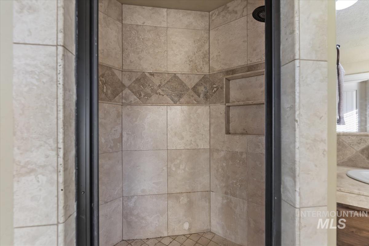1082 East Azan Street Meridian, ID 83646 - Photo 30 of 47 Bathroom view of a stall shower and vanity