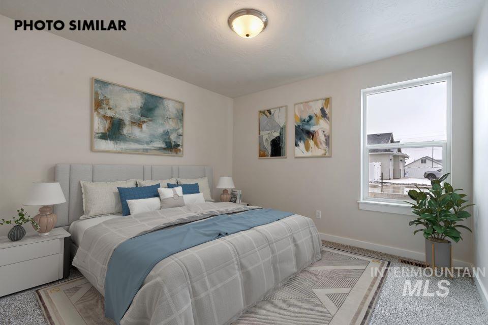 1645 Haystack Emmett, ID 83617 - Photo 26 of 33 Carpeted room featuring a single window with white trim, a flush-mount ceiling light fixture, and light-colored wall paint