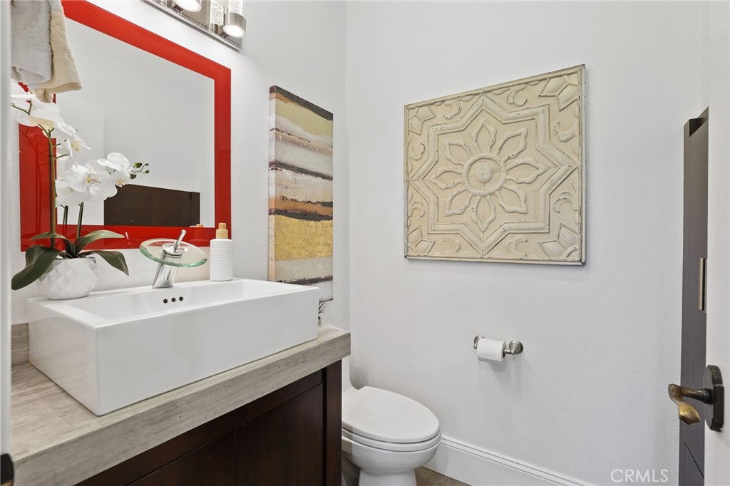 2 Olympic Way Coto de Caza, CA 92679 - Photo 18 of 75 a bathroom with a sink mirror vanity and toilet