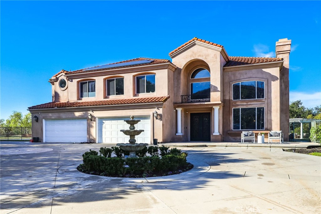 2 Olympic Way Coto de Caza, CA 92679 - Photo 3 of 75 a front view of a house with a yard