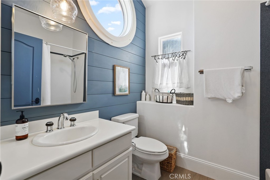 2 Olympic Way Coto de Caza, CA 92679 - Photo 37 of 75 a bathroom with a sink a toilet and a mirror