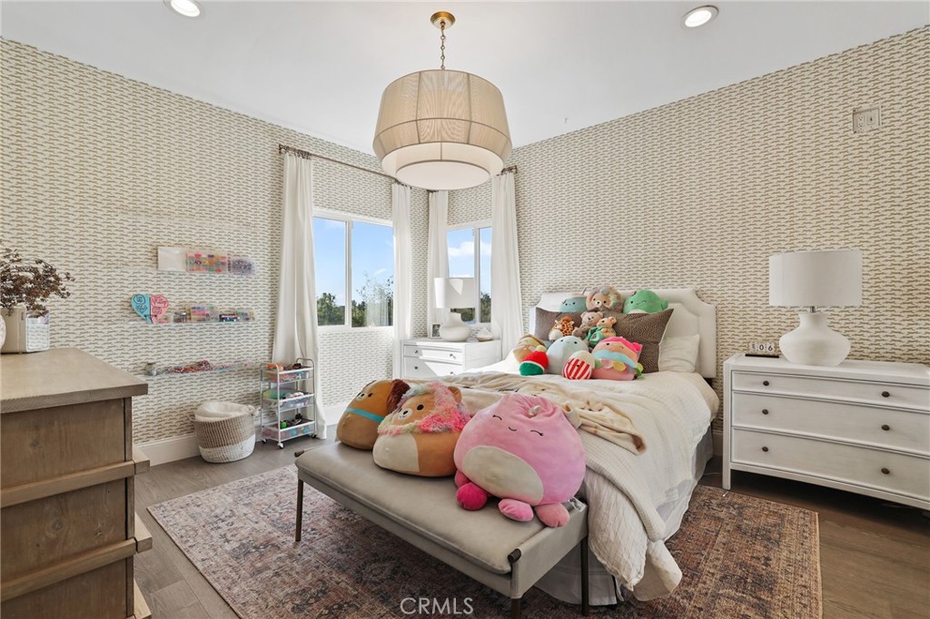 2 Olympic Way Coto de Caza, CA 92679 - Photo 41 of 75 a bedroom with a bed and wooden floor