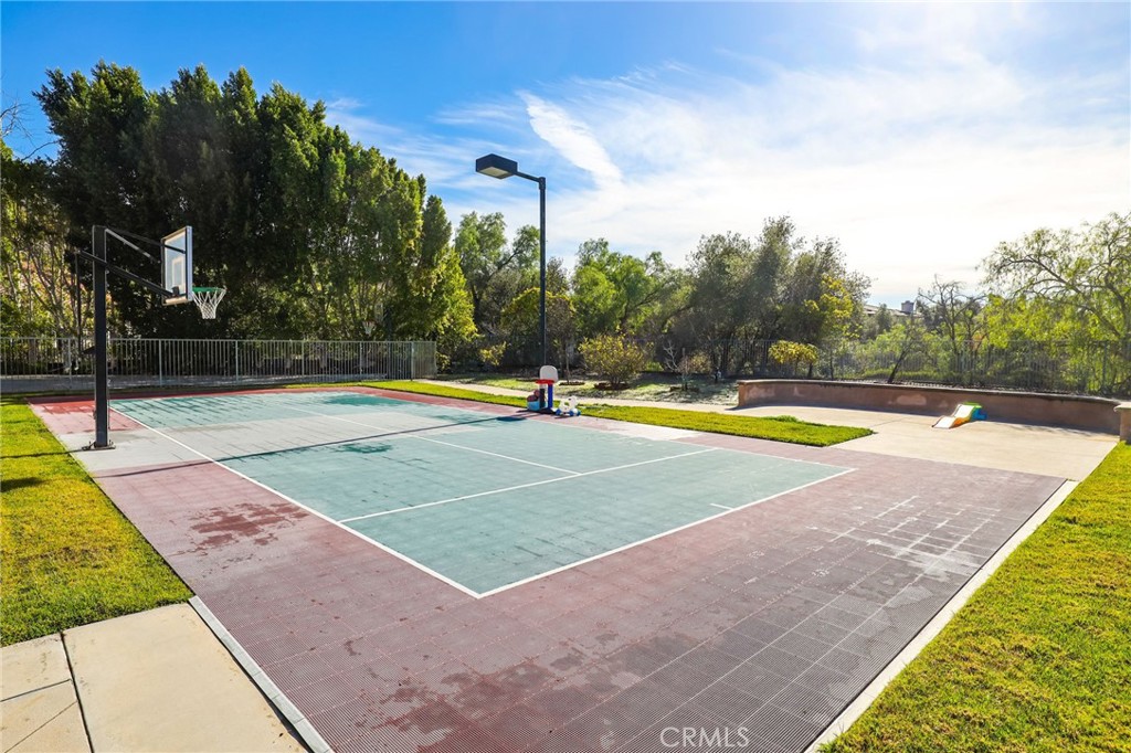 2 Olympic Way Coto de Caza, CA 92679 - Photo 64 of 75 a view of a swimming pool with an outdoor space and seating area