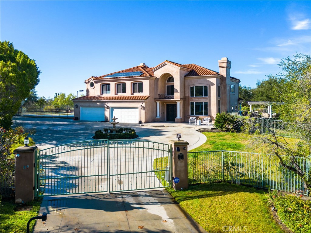 2 Olympic Way Coto de Caza, CA 92679 - Photo 66 of 75 a front view of a house with a yard