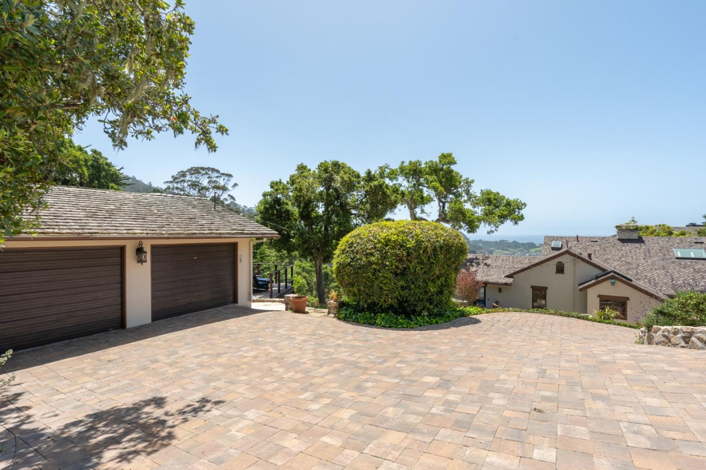 151 Highlands Drive Carmel, CA 93923 - Photo 30 of 31 a view of a house with a yard and garage