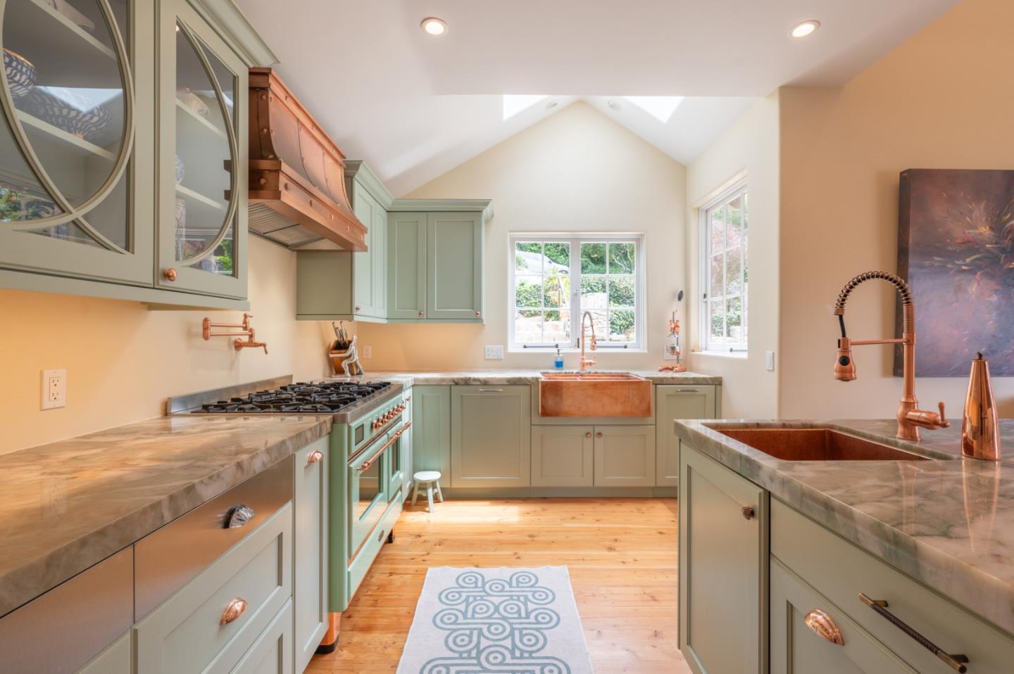 151 Highlands Drive Carmel, CA 93923 - Photo 9 of 31 a kitchen with a sink stove and cabinets