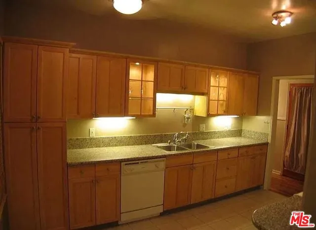 a kitchen with a refrigerator and a stove