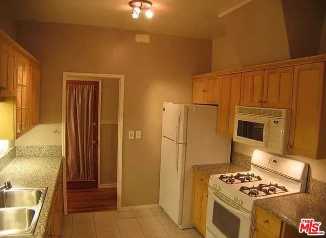 a bathroom with a shower and a glass door