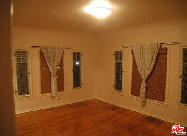 a view of a bathroom with tub and door