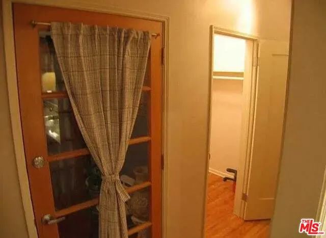 a view of front door with wooden floor