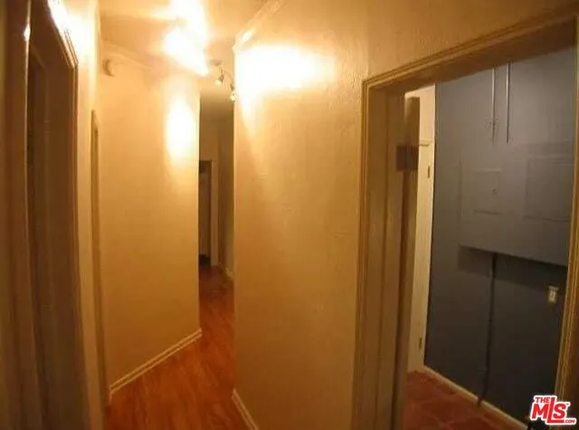 a kitchen with a sink and a refrigerator