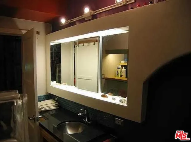 a kitchen with a stove and a refrigerator