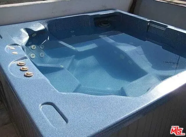 a bathroom with a tub and sink