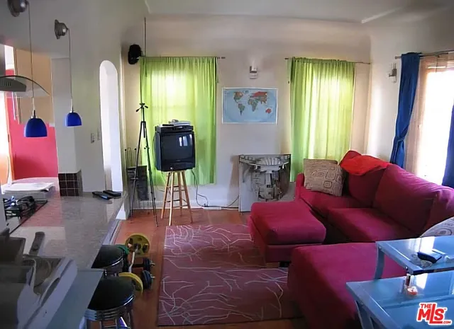 a bedroom with a bed and a chair