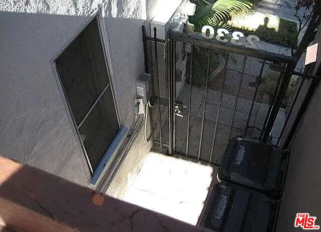 a view of two chairs in the balcony