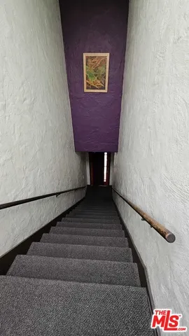 a kitchen with stainless steel appliances granite countertop a stove and a refrigerator
