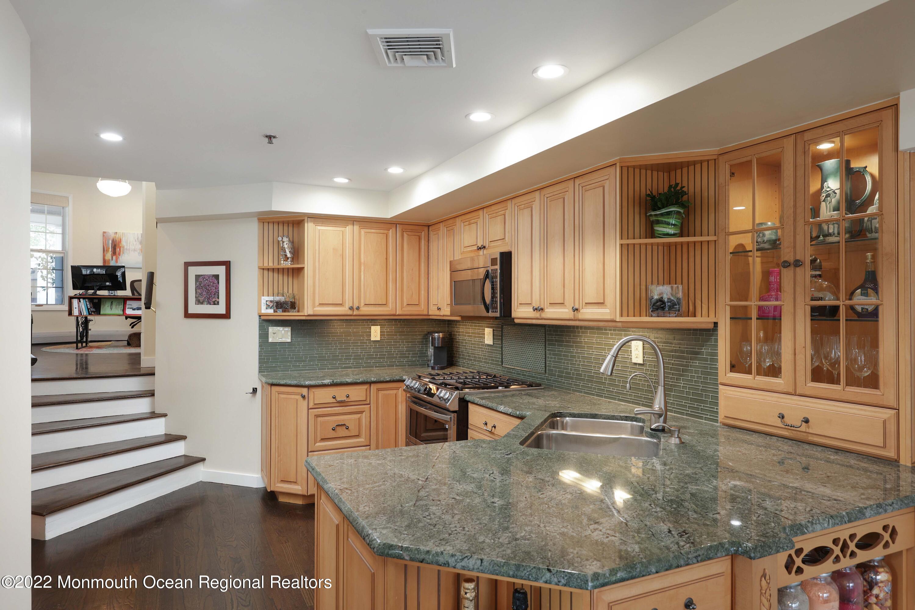 68 C West Front Street Red Bank, NJ 07701 - Photo 13 of 41 a kitchen with stainless steel appliances granite countertop a sink a stove and a microwave