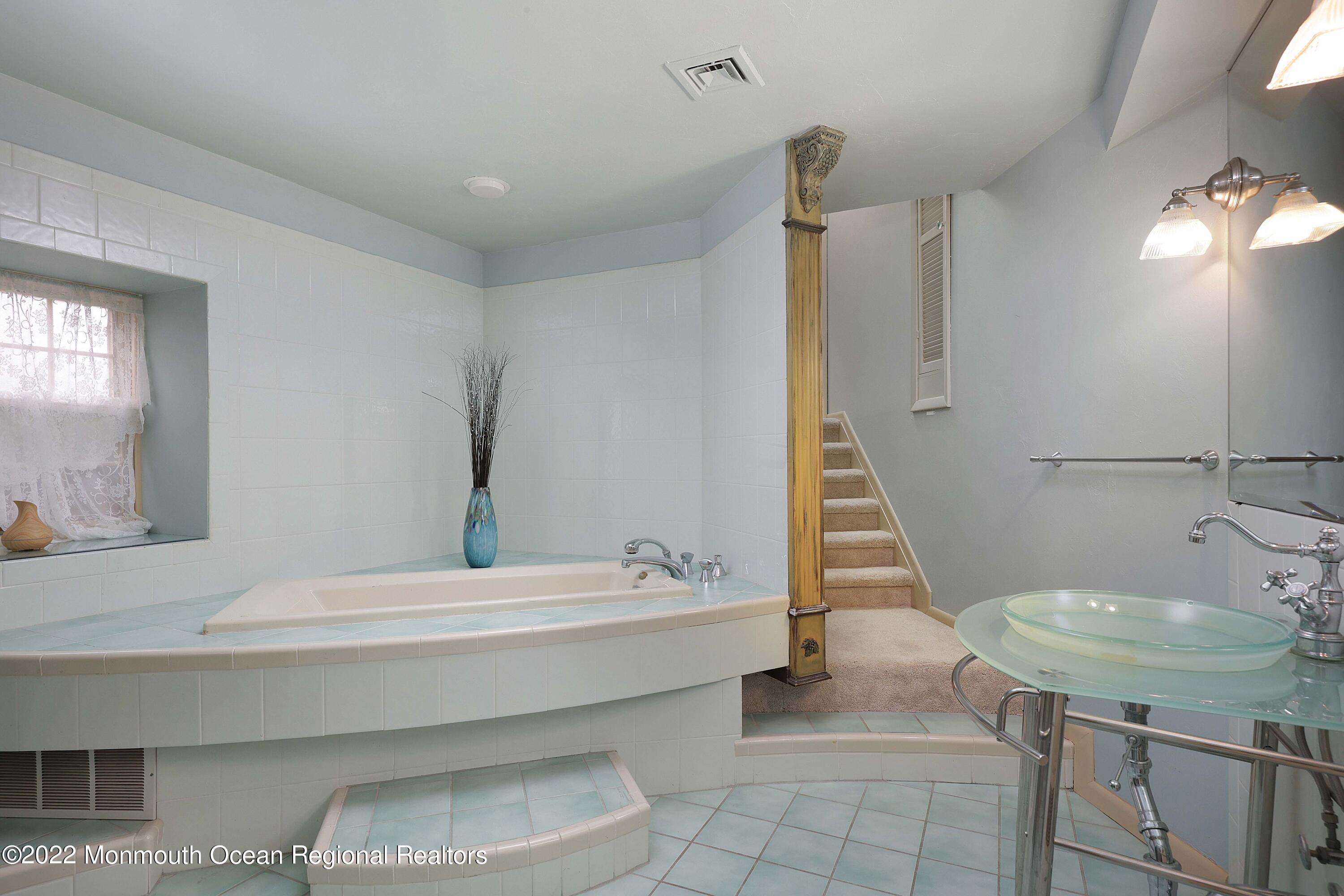 68 C West Front Street Red Bank, NJ 07701 - Photo 21 of 41 a bathroom with a sink and a mirror
