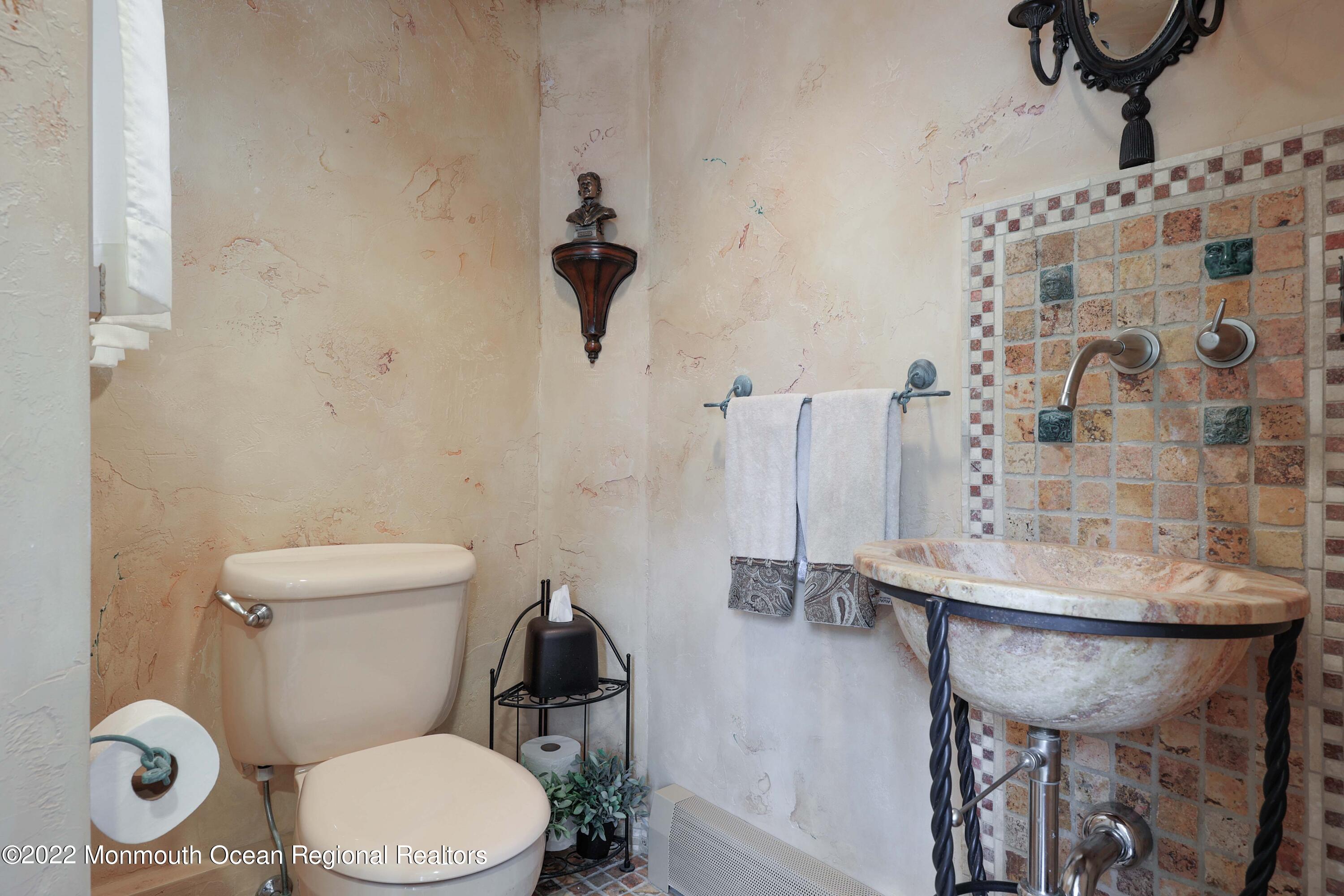 68 C West Front Street Red Bank, NJ 07701 - Photo 22 of 41 a bathroom with a sink toilet and a mirror