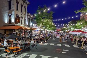 68 C West Front Street Red Bank, NJ 07701 - Photo 36 of 41 a city street filled with lots of traffic and lots of people