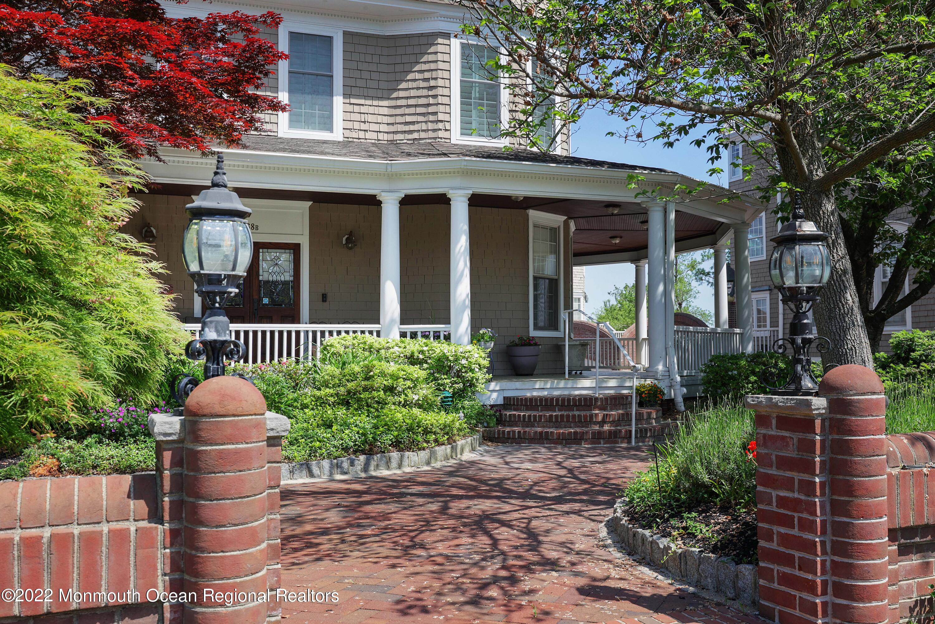 68 C West Front Street Red Bank, NJ 07701 - Photo 41 of 41 a front view of a house with a garden and plants