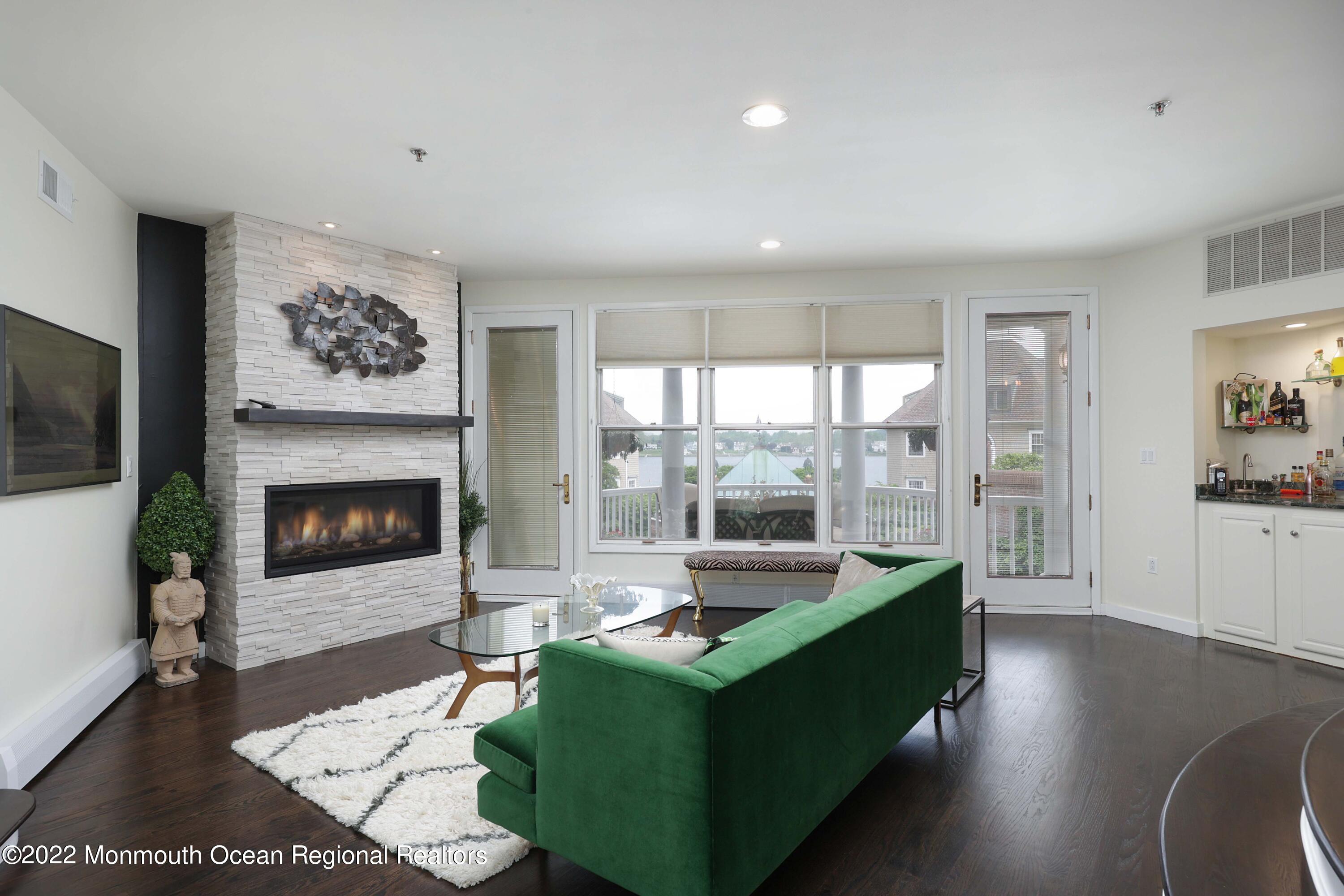 68 C West Front Street Red Bank, NJ 07701 - Photo 5 of 41 a living room with furniture large window and a fireplace