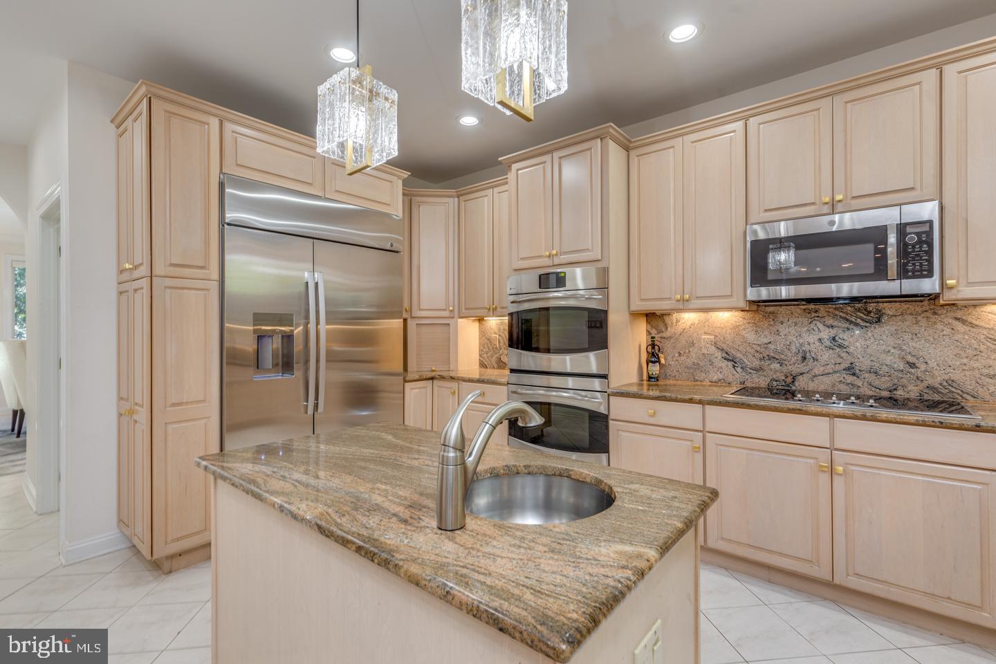 2 Collage Court Cherry Hill, NJ 08003 - Photo 15 of 89 a kitchen with kitchen island granite countertop a sink stainless steel appliances and cabinets