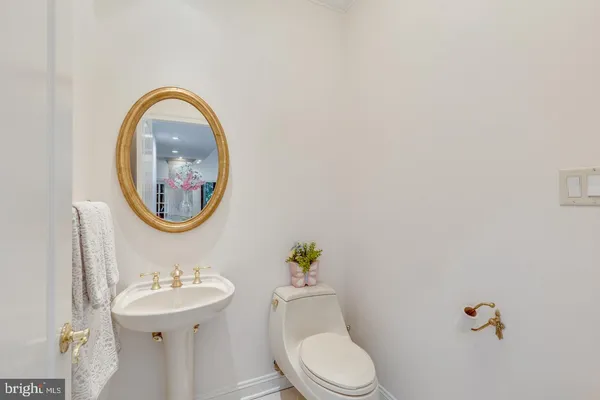 a bathroom with a sink a large mirror and a shower