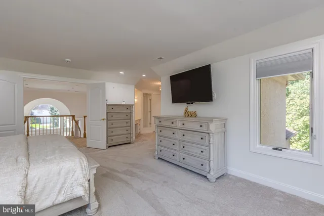 a kitchen with cabinets appliances a sink and a counter top space