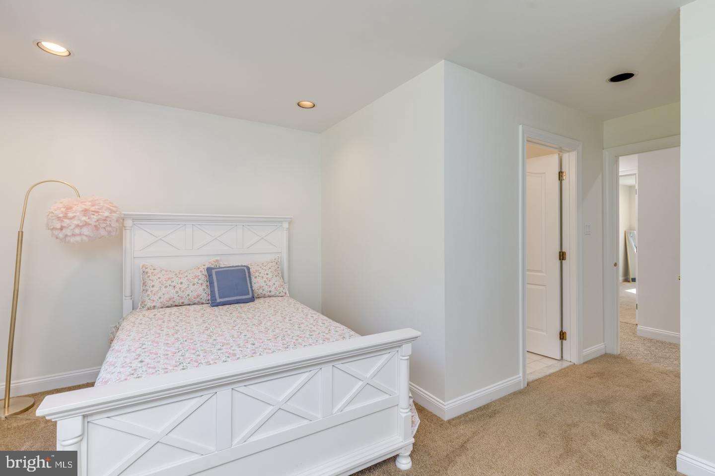 2 Collage Court Cherry Hill, NJ 08003 - Photo 58 of 89 a bedroom with a bed and a chandelier