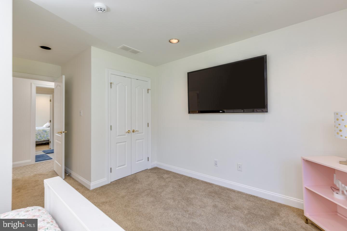 2 Collage Court Cherry Hill, NJ 08003 - Photo 59 of 89 a room with a flat screen tv and a wall painting