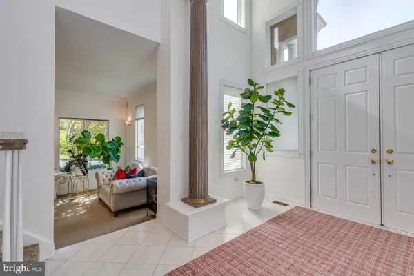 a view of entryway and hall with dining room