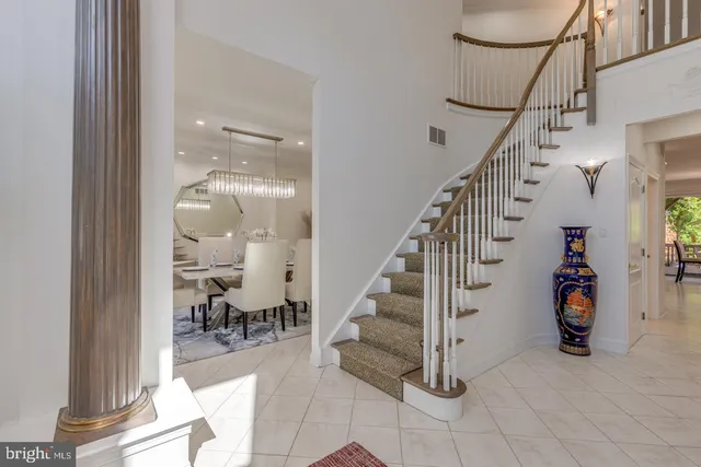 a view of a dining room with furniture and chandelier