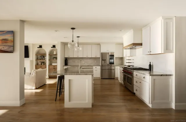 a spacious bedroom with a bed and a window