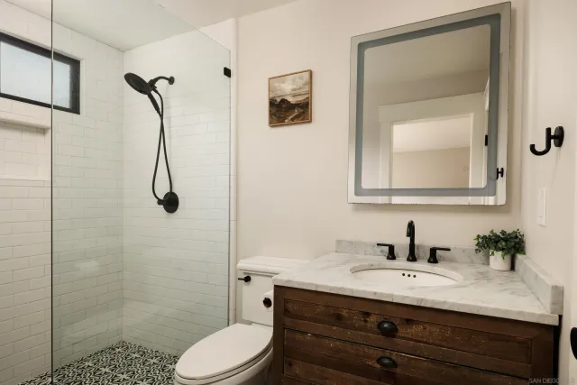 a living room with wooden floor and a table