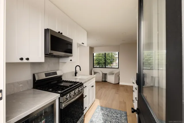 a spacious bathroom with a sink double vanity and a mirror
