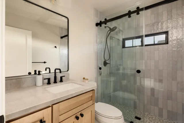 a view of a terrace with furniture and city view