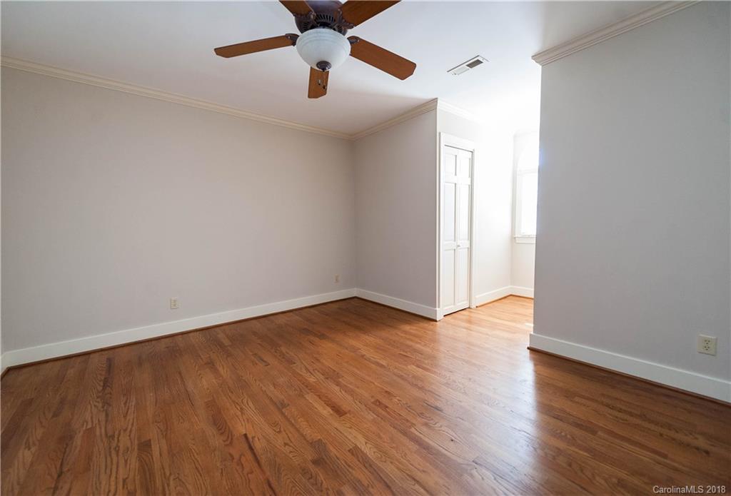 484 Pierce Road Landrum, SC 29356 - Photo 12 of 35 an empty room with wooden floor and windows