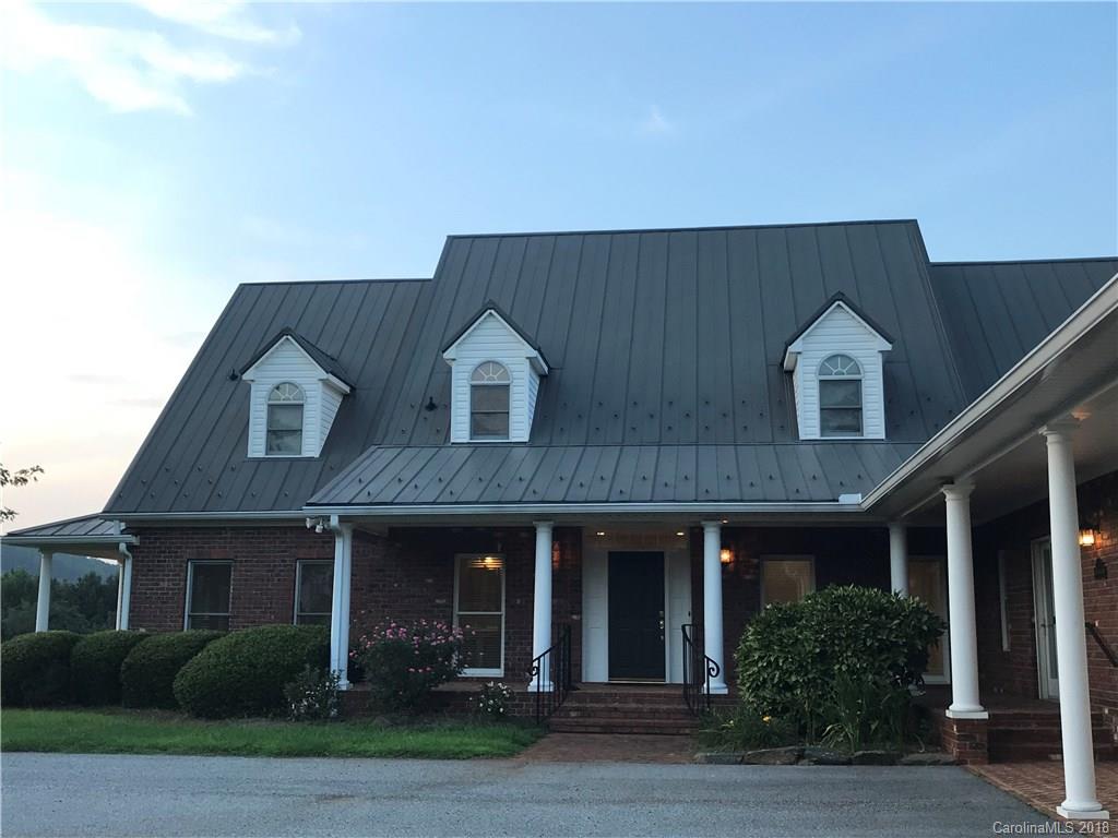484 Pierce Road Landrum, SC 29356 - Photo 20 of 35 a front view of a house with a garden
