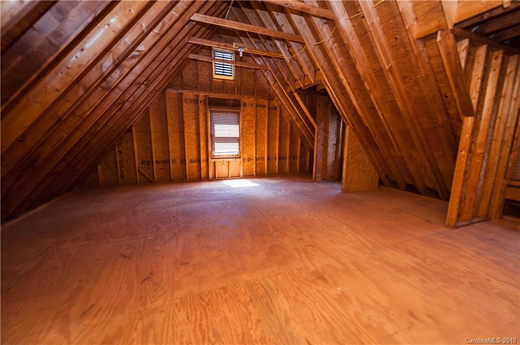 484 Pierce Road Landrum, SC 29356 - Photo 27 of 35 an empty room with windows