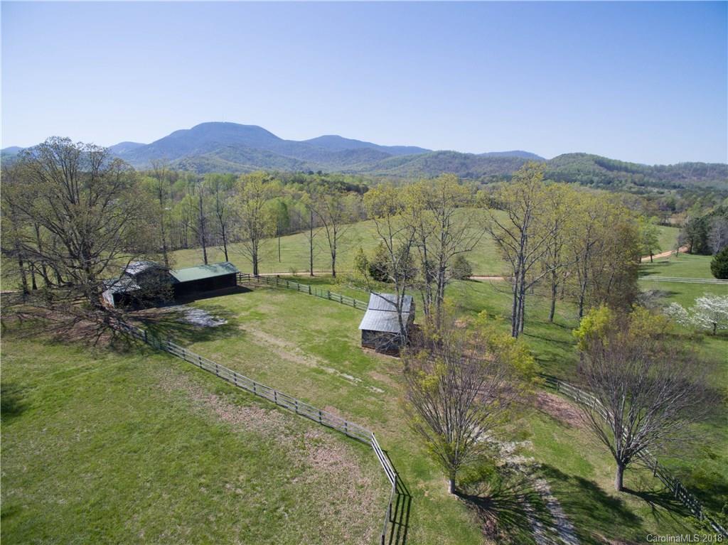 484 Pierce Road Landrum, SC 29356 - Photo 32 of 35 a view of a lush green hillside and houses