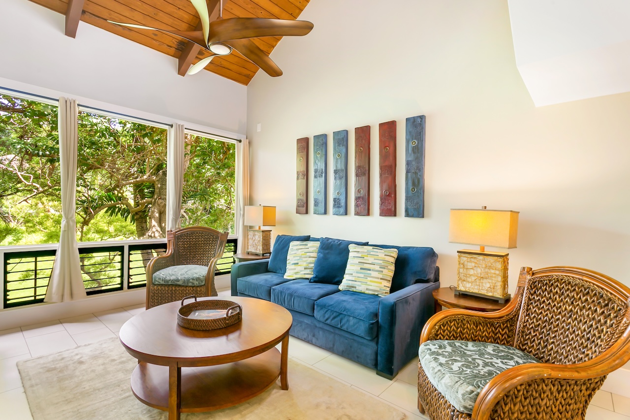 2330 Ho'ohu Road, Unit 16 Koloa, HI 96756 - Photo 12 of 29 a living room with furniture and a large window